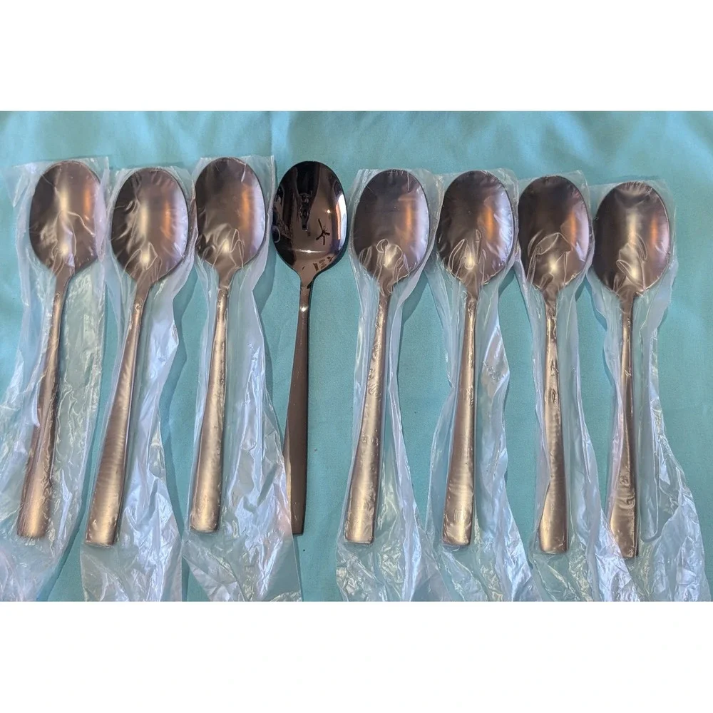 8 larger Black Spoons 7